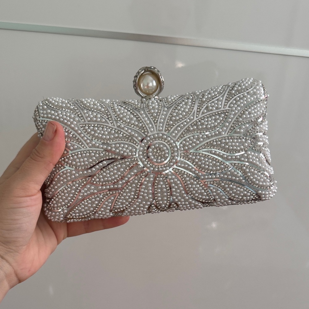 Elegant Silver Clutch with Pearl Accent